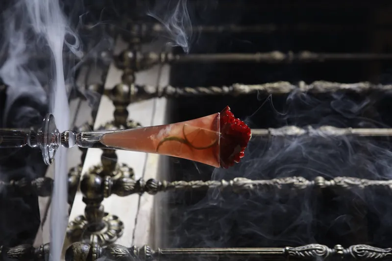 Smoking cocktail cone over the bar