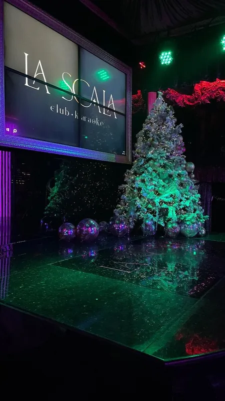 The stage and dance floor under green lights